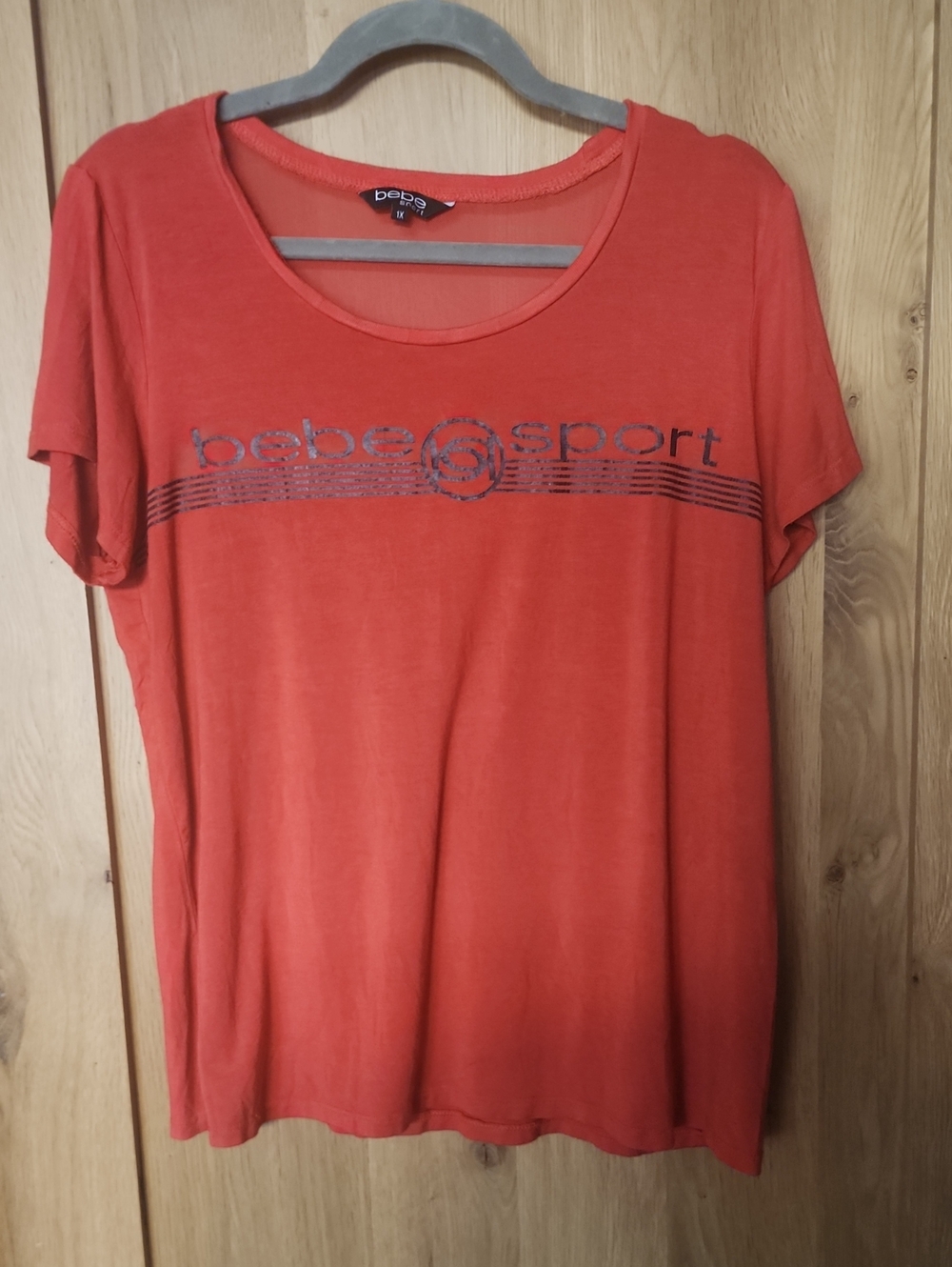 bebe Coral Scoop Neck Short Sleeve Tee with Metallic Logo. #0055